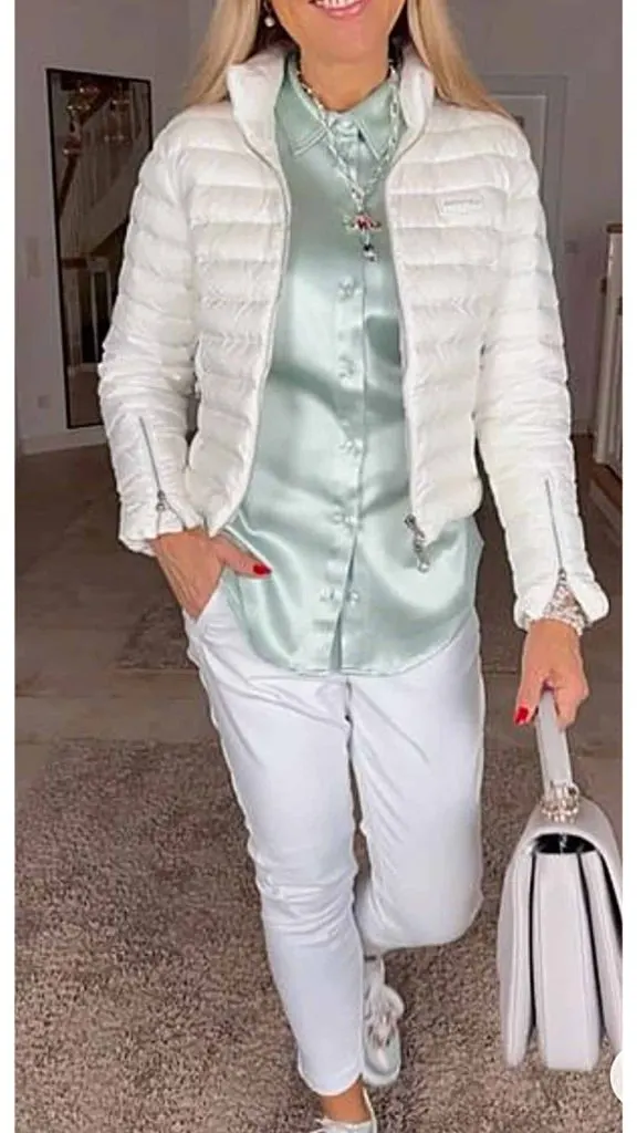 white puffer jacket and cream jeans