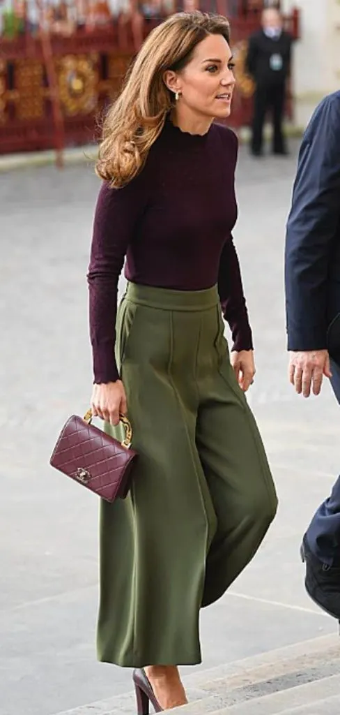 KHAKI pants and purple top