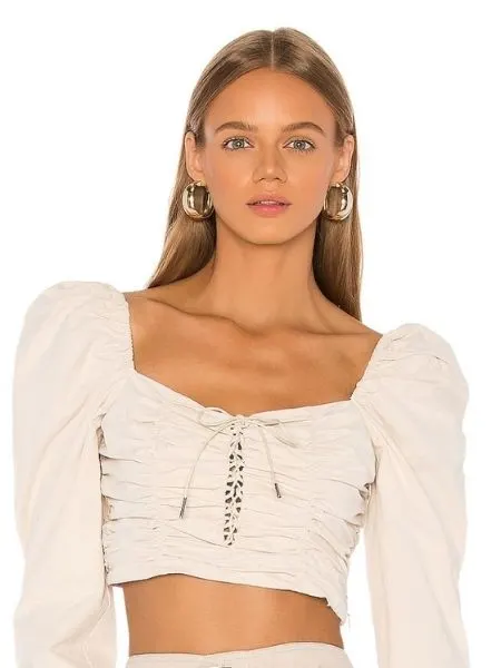 wear a duffy blouse on top of lace dress for a feminine look